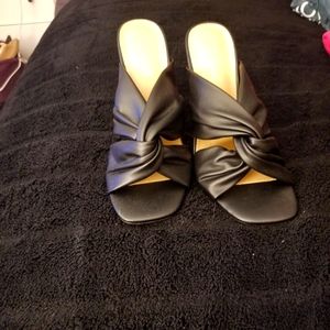 Black heeled sandals with a clear and Gold heel